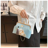 Elegant Floral Embroidered Handbag with Kiss-Lock, Tassel Detail Blue